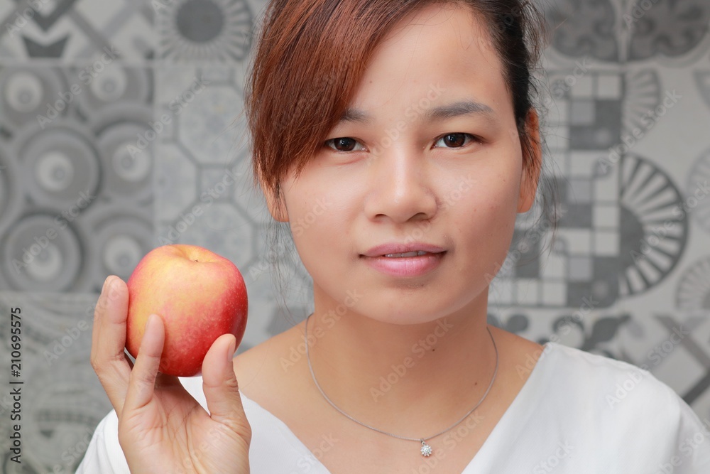 a woman with fruit in the kitchen a woman with fruit in the kitchen