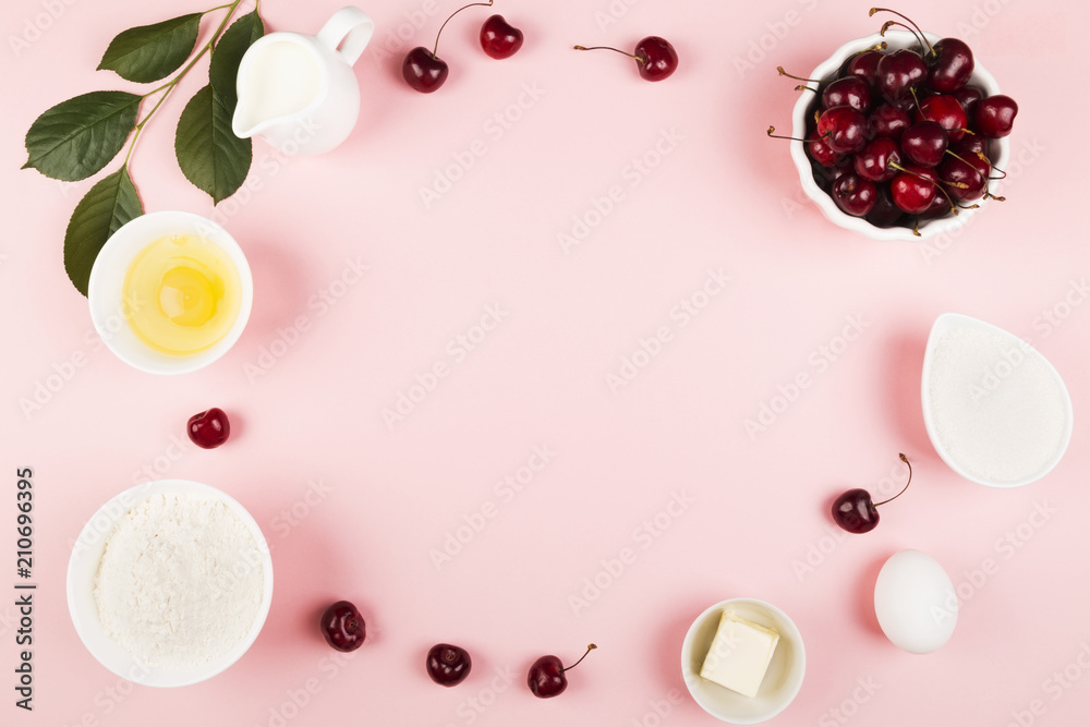 Ingredients for cherry pie - milk, butter, eggs, flour, cherry, sugar on a pink background. Top view, copy space. Food background Ingredients for cherry pie - milk, butter, eggs, flour, cherry, sugar on a pink background. Top view, copy space. Food background