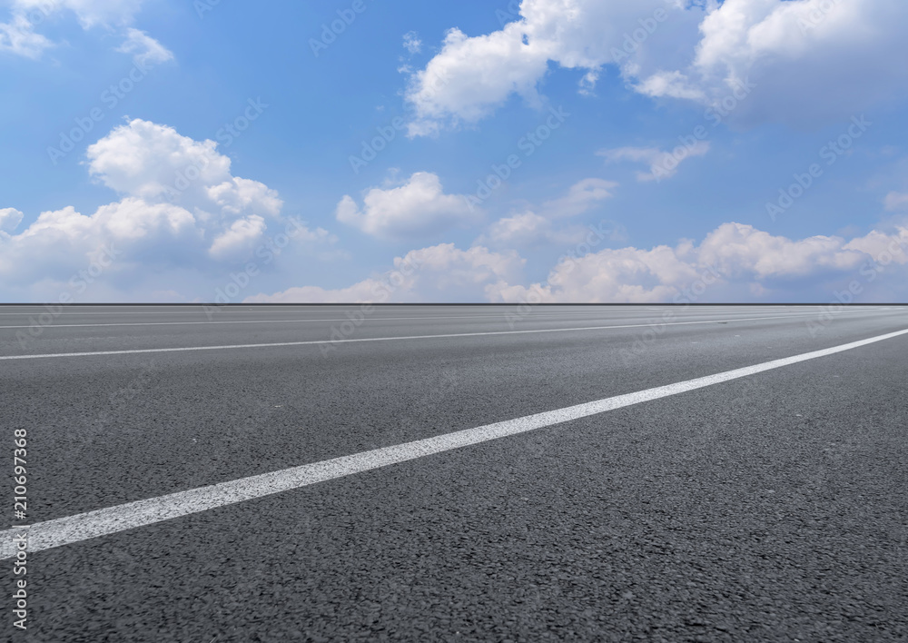 asphalt highway road under the blue sky