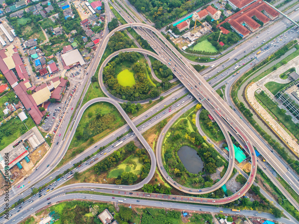 Fototapeta premium Of traffic on city streets in Thailand. Aerial view and top view Expressway with car lots.