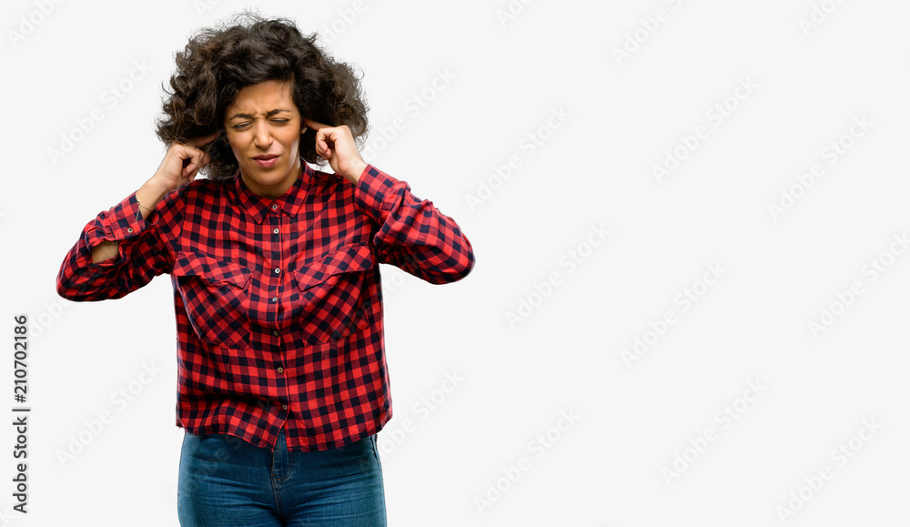 Beautiful arab woman covering ears ignoring annoying loud noise, plugs ears to avoid hearing sound. Noisy music is a problem. Beautiful arab woman covering ears ignoring annoying loud noise, plugs ears to avoid hearing sound. Noisy music is a problem.