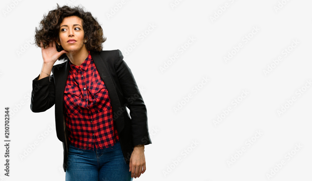 Beautiful arab woman holding hand near ear trying to listen to interesting news expressing communication concept and gossip Beautiful arab woman holding hand near ear trying to listen to interesting news expressing communication concept and gossip