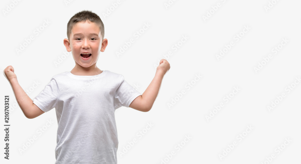 Dark haired little child screaming proud and celebrating victory and success very excited, cheering emotion Dark haired little child screaming proud and celebrating victory and success very excited, cheering emotion