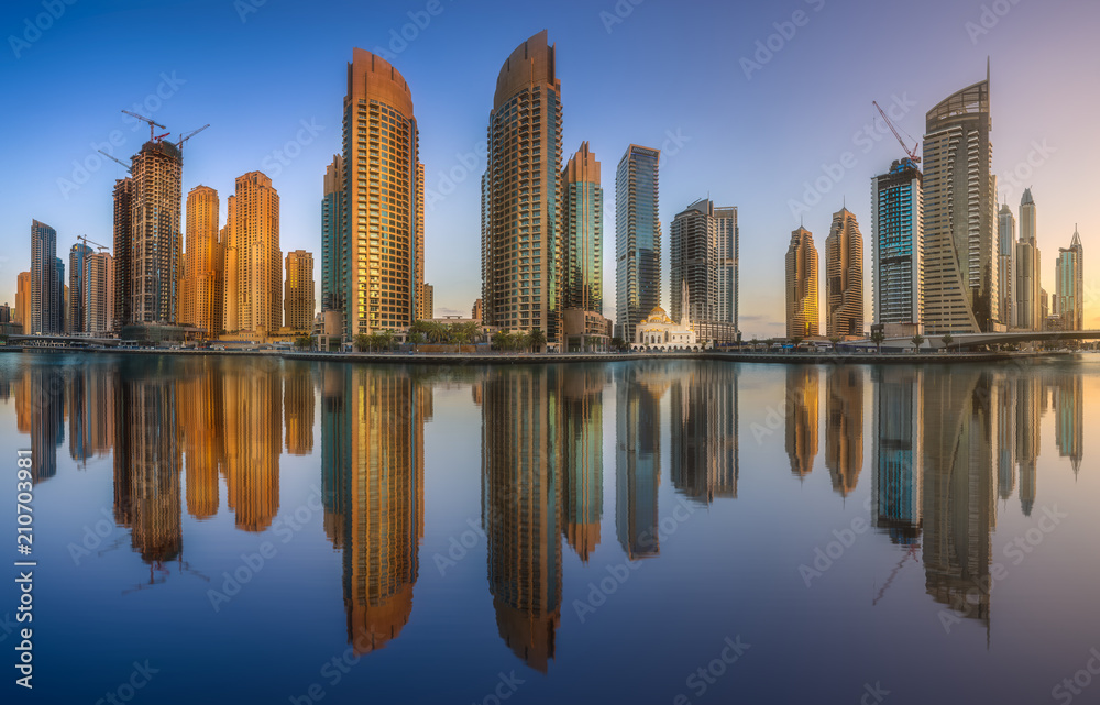Day view of Dubai Marina bay with clear sky, UAE