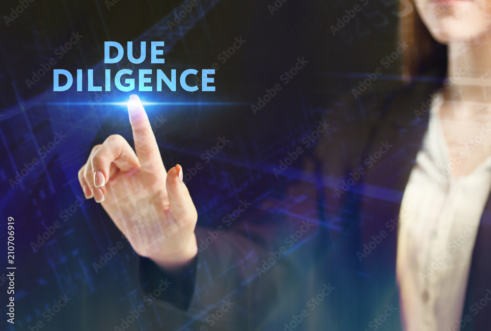 The concept of business, technology, the Internet and the network. A young entrepreneur working on a virtual screen of the future and sees the inscription: Due diligence The concept of business, technology, the Internet and the network. A young entrepreneur working on a virtual screen of the future and sees the inscription: Due diligence