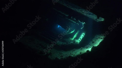 Dark corridor inside the shipwreck with magical sun rays - Umbria, Sudan photo
