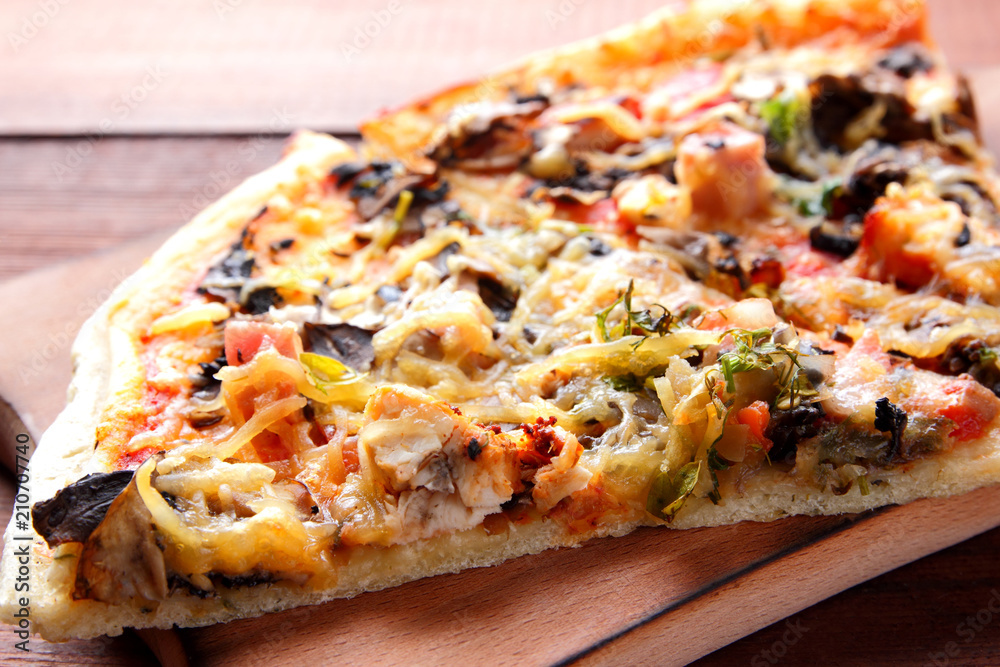 Pizza slices on a wooden board, Italian pizza on a wooden background top view, Italian food in vintage style, appetizing dish for summer vacation, American food, copy space, art Pizza slices on a wooden board, Italian pizza on a wooden background top view, Italian food in vintage style, appetizing dish for summer vacation, American food, copy space, art