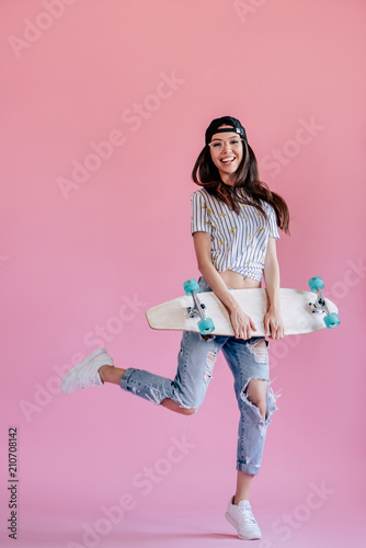 Young girl on pink background photo