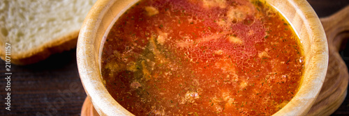 Traditional Ukrainian Russian vegetable borscht on the old wooden background banner