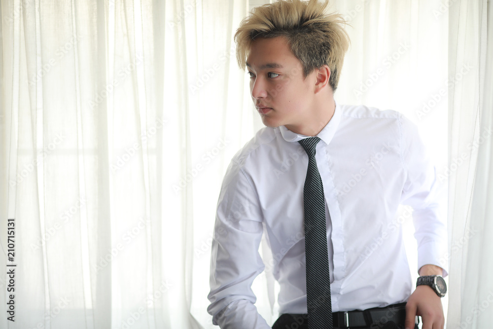 Young Asian businessman in white shirt and tie Young Asian businessman in white shirt and tie
