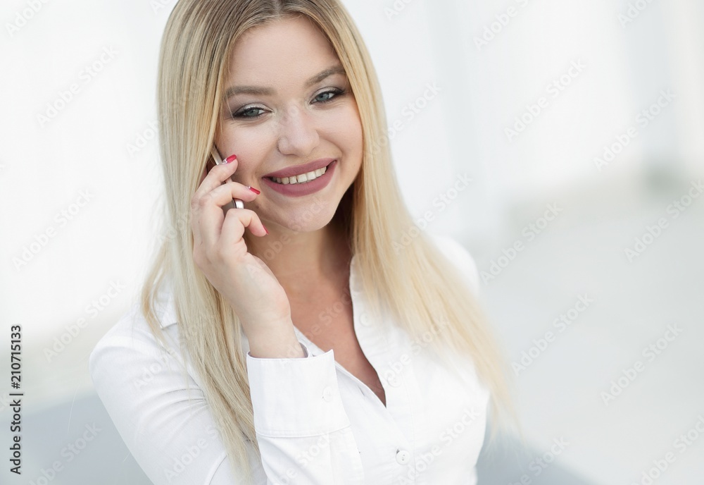 closeup of confident business woman talking on a mobile phone. closeup of confident business woman talking on a mobile phone.