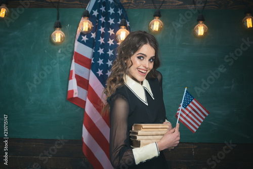 Be cool and you will be able to attract and retain lot more students. Happy students at the lesson with USA national flag. Learning English language in USA photo