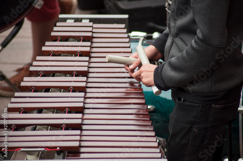 closeup of xylophone player in the street
