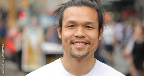 Asian man in city face portrait smile happy