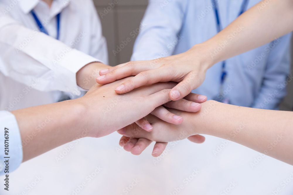 Business people join their hand together in teamwork concept