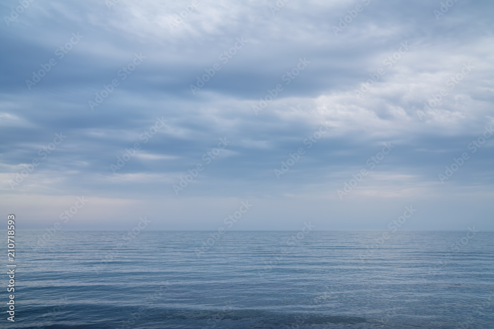 Beautiful sea and clouds sky.Seascape with grey clouds Beautiful sea and clouds sky.Seascape with grey clouds