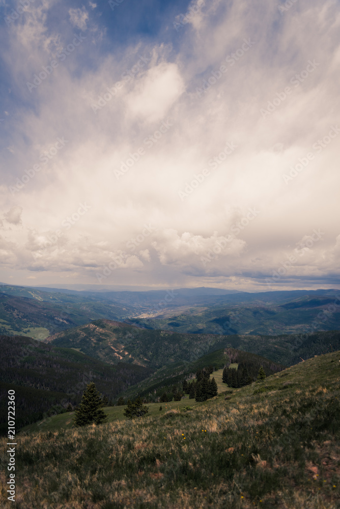 Landscape view looking over Minturn, Colorado during a storm on Vail Mountain. 
