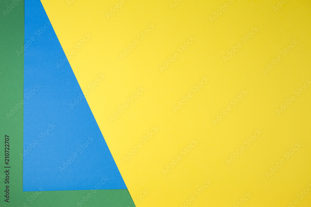 Color papers composition background with yellow, green and blue tones Color papers composition background with yellow, green and blue tones