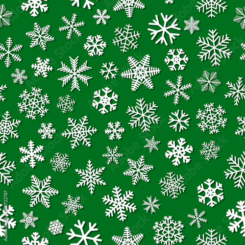 Christmas seamless pattern of snowflakes with shadows, white on green background