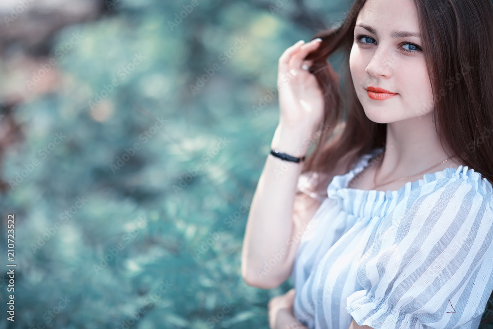 Fototapeta premium A girl in a spring green park