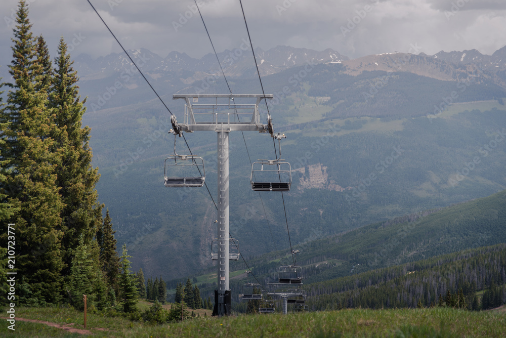 A ski lift with a storm in the back ground in Vail, Colorado. 