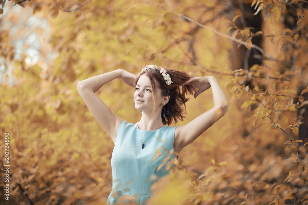 Young girl on a walk in the autumn 