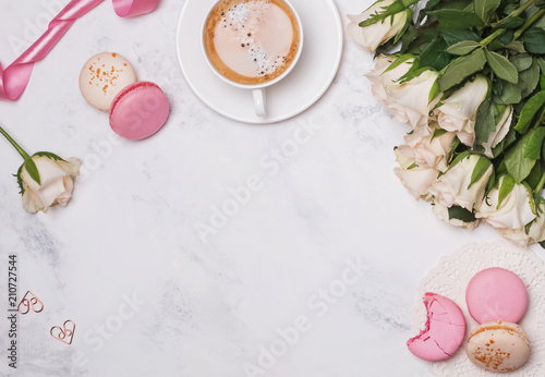 Flat lay with macarons, coffee and roses