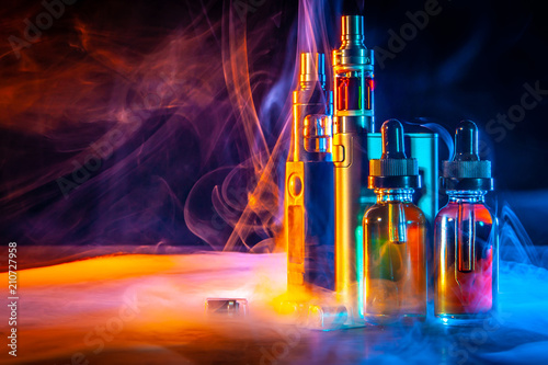 VAPE Electronic Cigarette. Liquid for VAPE. Steam from an electronic cigarette. VAPE concept photo