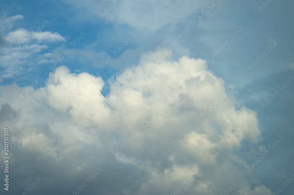 A blue day sky with rare beautiful clouds for the designer's background A blue day sky with rare beautiful clouds for the designer's background