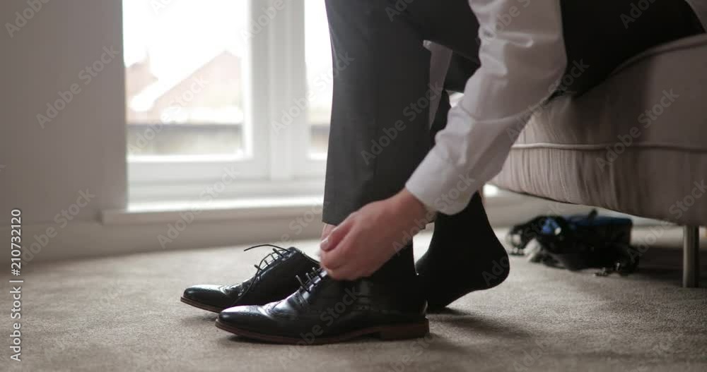 Man Tying Shoe Laces