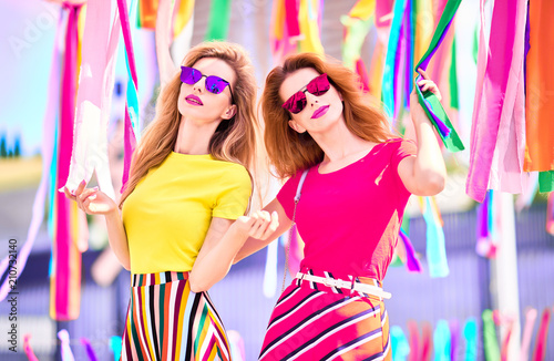 Two Girls with Colorful ribbons around. Outdoor