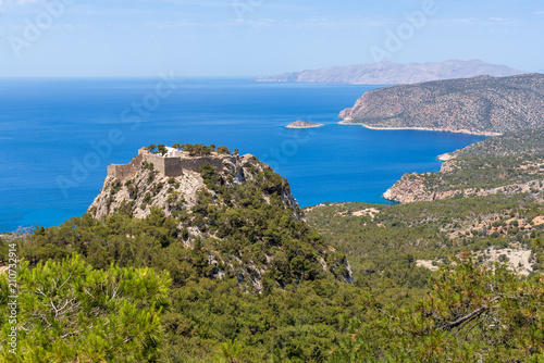 The castle of Monolithos located at the summit of the tall and craggy rock. Rhodes island, Greece