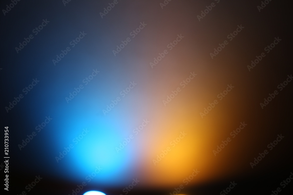 Lanterns of yellow and blue glow on a dark background Stock Photo | Adobe  Stock