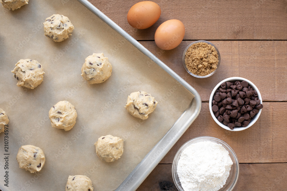 Top down view on chocolate chip cookie dough baking scene