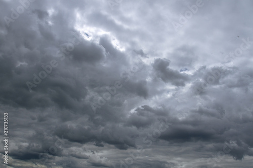 Background of dramatic sky with dark clouds. Sky before a thunder-storm.