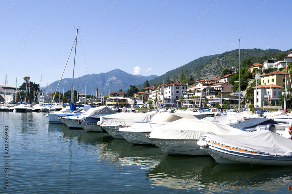 .Lake with boats on the water. Beautiful landscape in Italy with boats on the water.