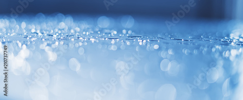 Blue glass with raindrops background texture horizontal top view isolated, rain on window backdrop, abstract light bokeh and defocus drops, clear water on space blank back, mockup rainy nuture