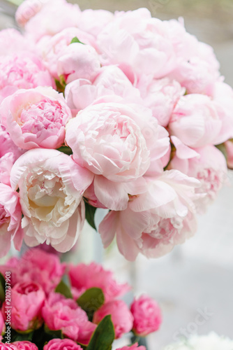 Lovely flowers in glass vase. Beautiful bouquet of pink peonies . Floral composition  scene  daylight. Wallpaper