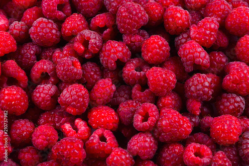 Fresh raspberries background. Closeup photo, top view.