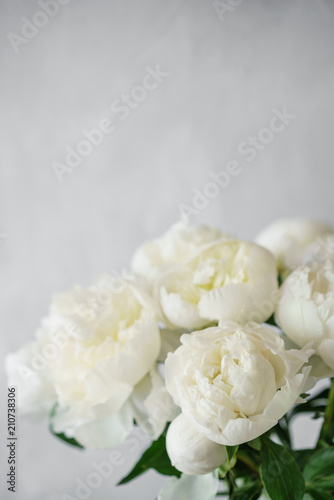 Lovely flowers in glass vase. Beautiful bouquet of white peonies . Floral composition  scene  daylight. Wallpaper