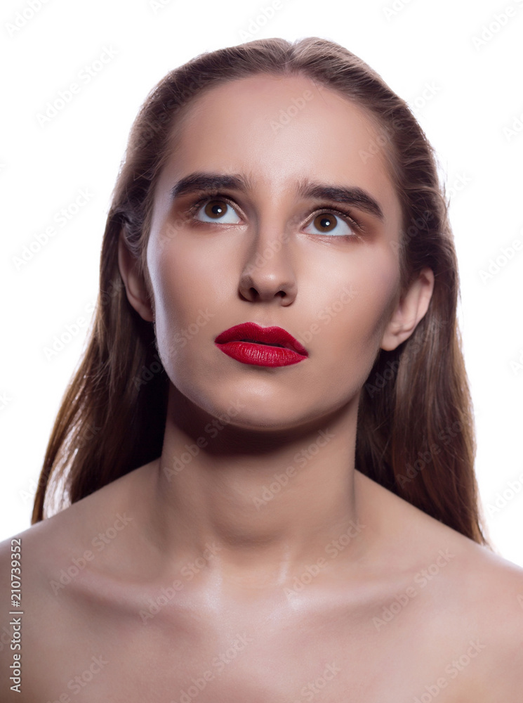 Closeup portrait of pensive brunette girl with bright makeup, posing on a white background Closeup portrait of pensive brunette girl with bright makeup, posing on a white background