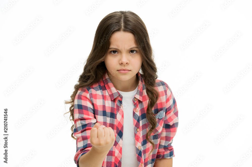 Child show fist gesture isolated on white. Little girl with long curly hair feel anger. Girls power. protection of children's rights, sense of justice. My word law. Beauty look Child show fist gesture isolated on white. Little girl with long curly hair feel anger. Girls power. protection of children's rights, sense of justice. My word law. Beauty look