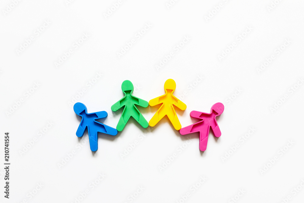 Friendship of peoples is a symbol of colored men on a white background. Friendship of peoples is a symbol of colored men on a white background.