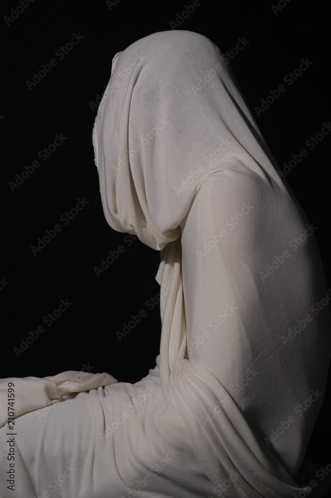 Lazarus, rising from the dead in the tomb. Studio shot of man wrapped ...