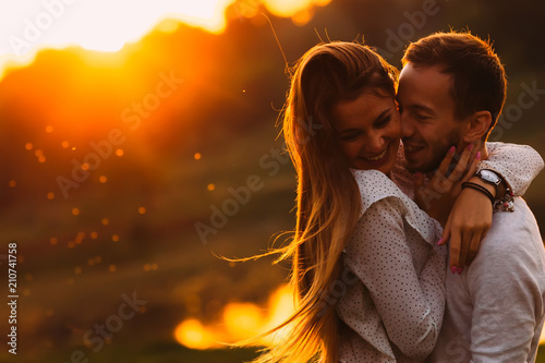 passionate hug of a couple in love on the shore of an evening la photo