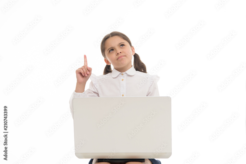Great idea. Girl work or play on laptop isolated on white. Little child got inspiration sitting with computer. Cyber monday. Online education. Just inspired. New technology for modern life, copy space