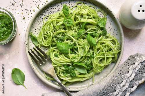 Spaghetti pasta with pesto sauce - traditional dish of italian cuisine.Top view.