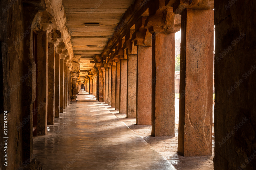 Beautiful view of hallway full of columns at an Indian ancient temple, Brihadeshwara temple, Thanjavur, Tamil Nadu, India