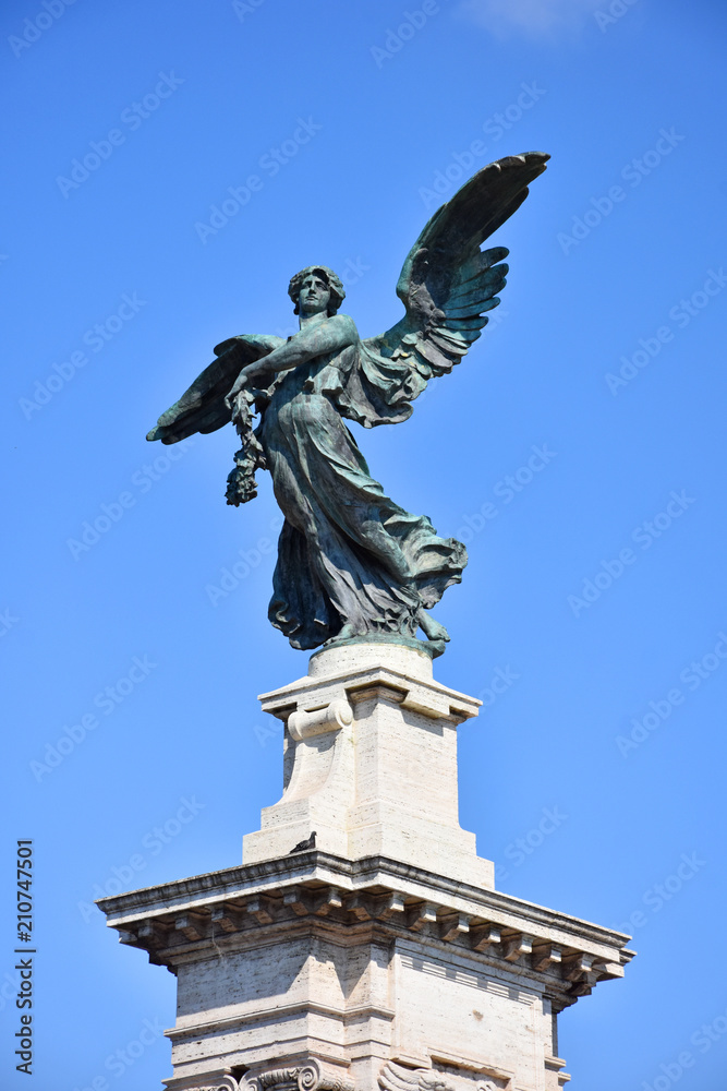 Rome, bronze statue of angel in a piazza of Pincio.