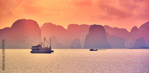 Tourist Junks in Halong Bay,Panoramic view of sunset in Halong Bay, Vietnam, Southeast Asia